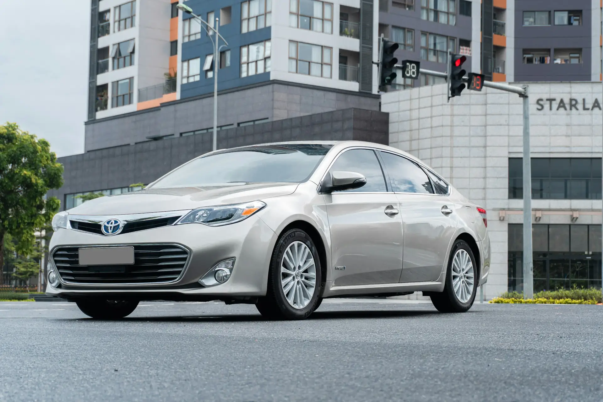 Silver Toyota sedan on a city street